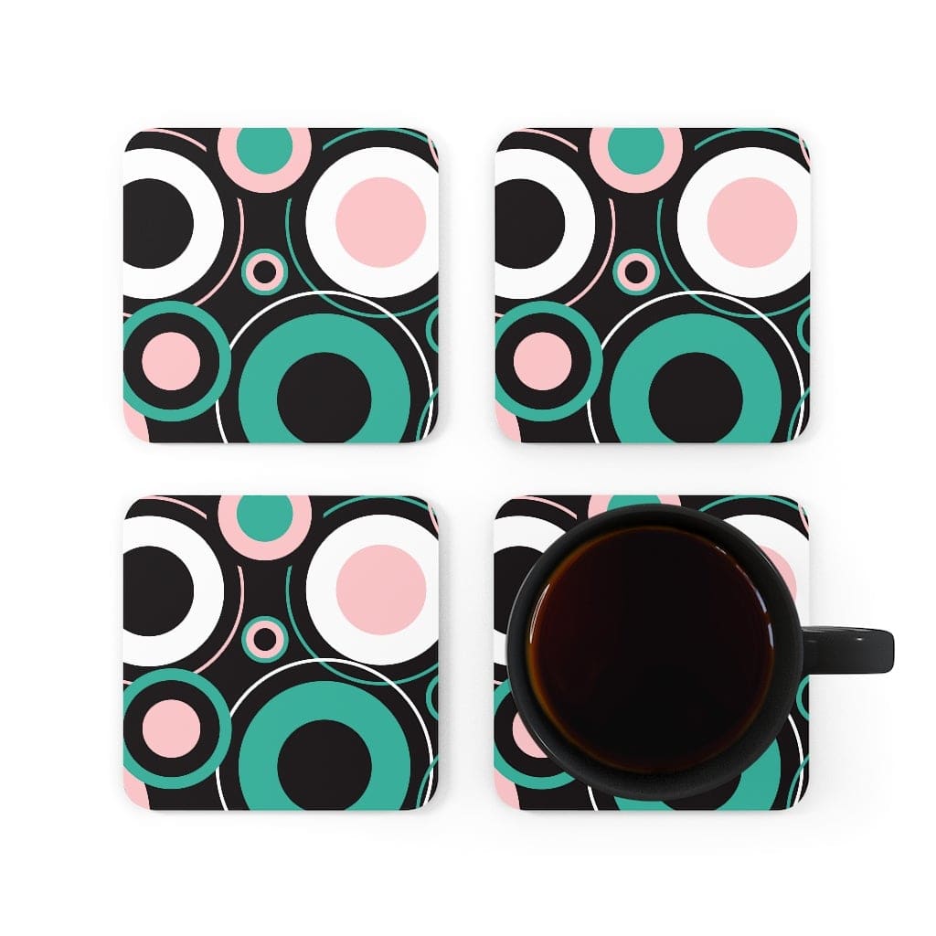 Four black, green, white and pink coasters