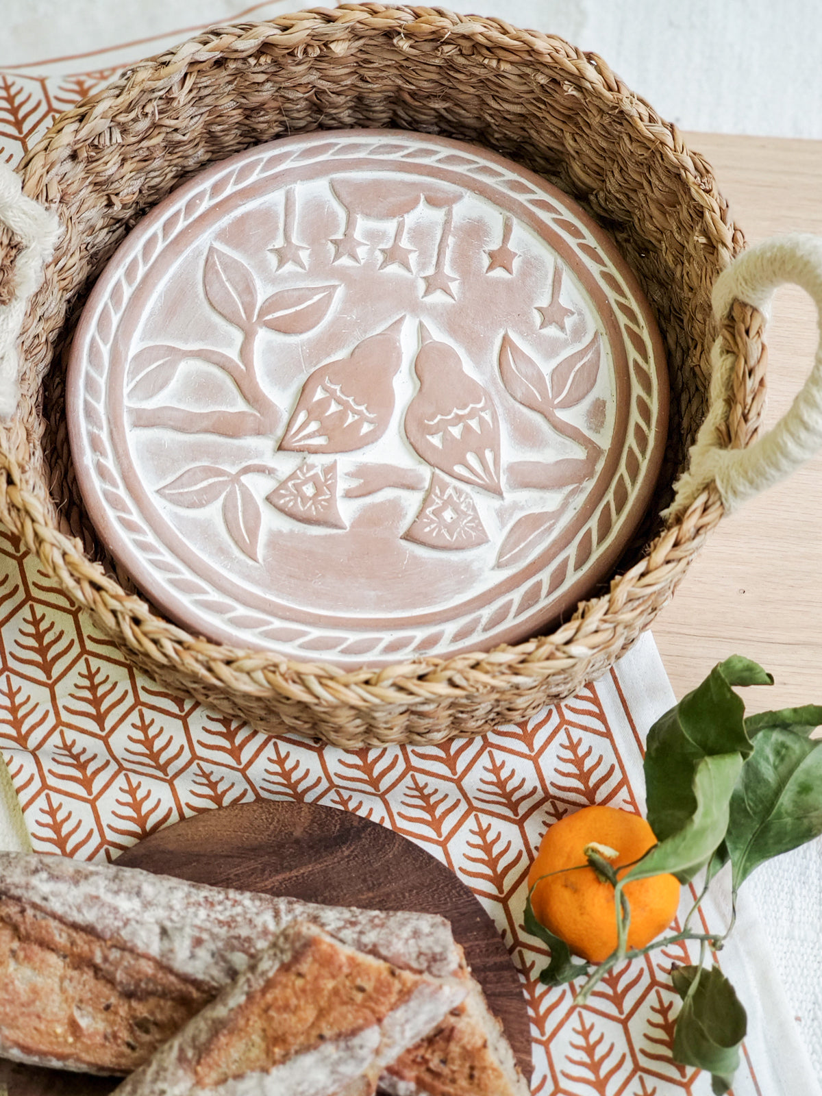 Terra Cotta breadwarming dish and natural jute basket with handles, plus tea towel